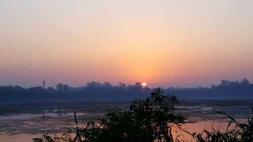 Scenic view of sea against sky during sunset