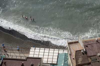 High angle view of people by sea