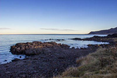 Scenic view of sea against clear sky