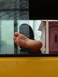 Reflection of man on glass window