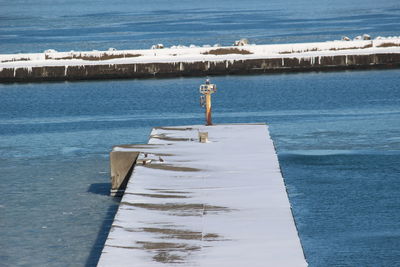 High angle view of pier over sea against sky