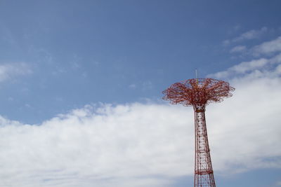 Low angle view of ferris wheel against sky