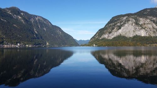 View of lake against blue sky