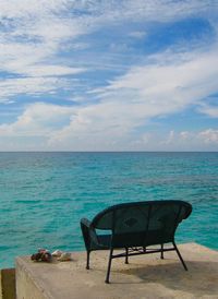 Scenic view of calm sea against cloudy sky