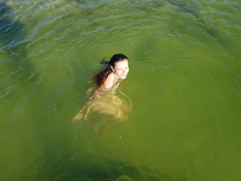 High angle view of woman swimming in water