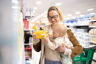 Portrait of young woman drinking milk