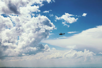 Low angle view of airplane flying in sky