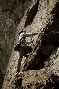 Man climb the rocky hill