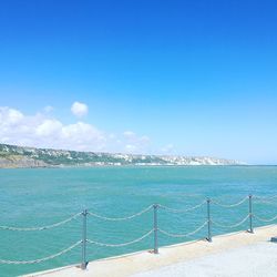 Scenic view of sea against clear blue sky