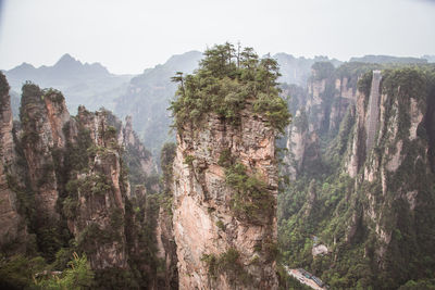 Panoramic view of trees and mountains against sky