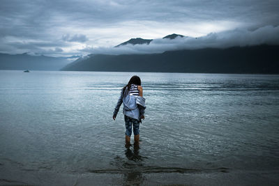 Man looking at lake