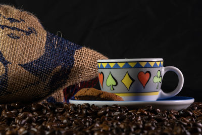 Close-up of coffee cup on table