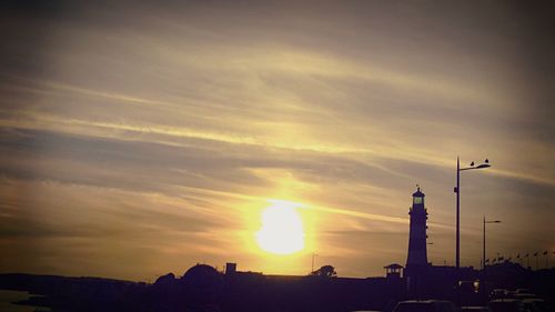 Silhouette of temple against sky during sunset