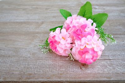 High angle view of pink flower on table