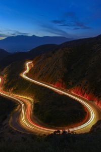 High angle view of light trails on road at night