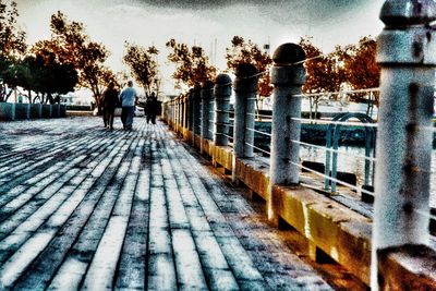 Woman walking on footpath