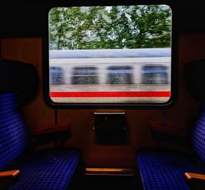 Blurred motion of train seen through window