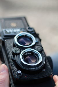 Close-up of hand holding camera