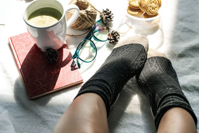 Relaxing autumn morning in bed with matcha tea and cookies