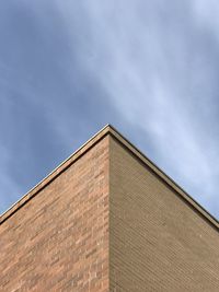 Low angle view of building corner against sky