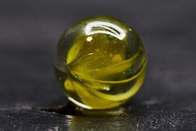 Close-up of wet glass on table