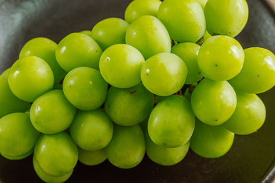 High angle view of grapes in bowl