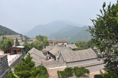 High angle view of houses and mountains against sky