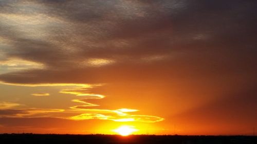 Scenic view of dramatic sky during sunset