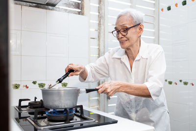 Man preparing food in kitchen