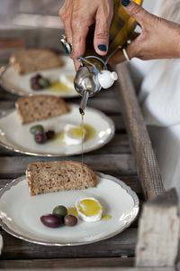 Midsection of person preparing food on table