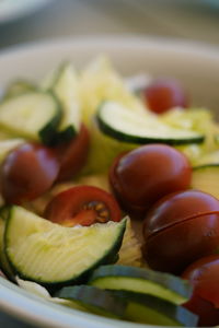 Close-up of chopped fruits in plate on table