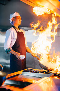 Man preparing food on stove