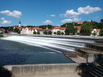 View of fountain in city against sky