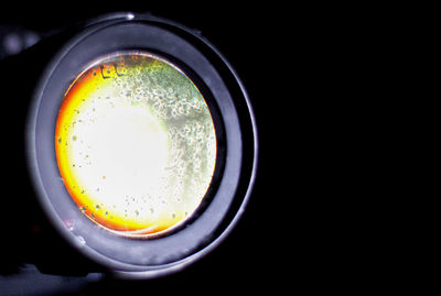 Directly above shot of glass over black background