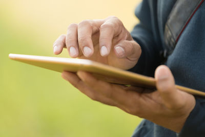 Close-up of man playing guitar