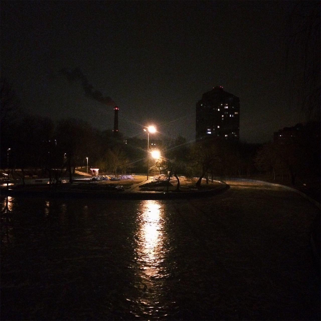 BOATS MOORED AT NIGHT