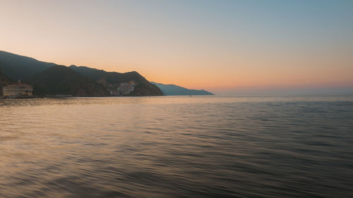 Scenic view of sea against clear sky during sunset