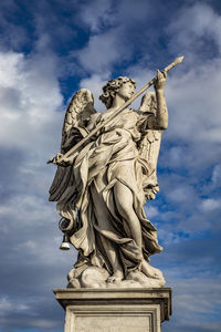 Low angle view of statue against sky