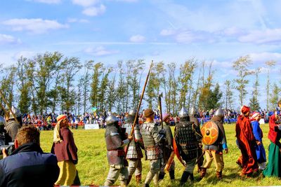 People on field against sky