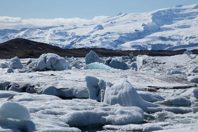 Scenic view of snowcapped mountains against sky