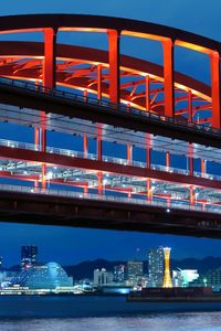 Bridge over river against blue sky