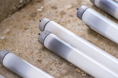 Straight fluorescent lamps on the cement floor