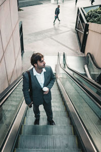 High angle view of man standing on elevator