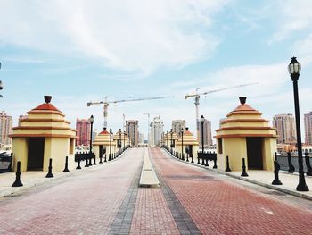 Street amidst buildings against sky