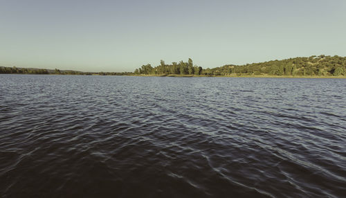 Scenic view of lake against clear sky