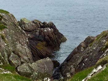 Scenic view of sea by rocks