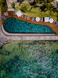 Aerial view of swimming pool by sea