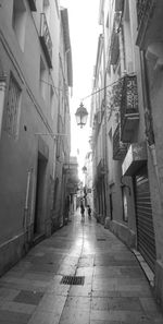 Narrow alley amidst buildings