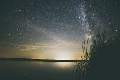 Scenic view of lake at night