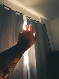 Close-up of hand touching illuminated light painting